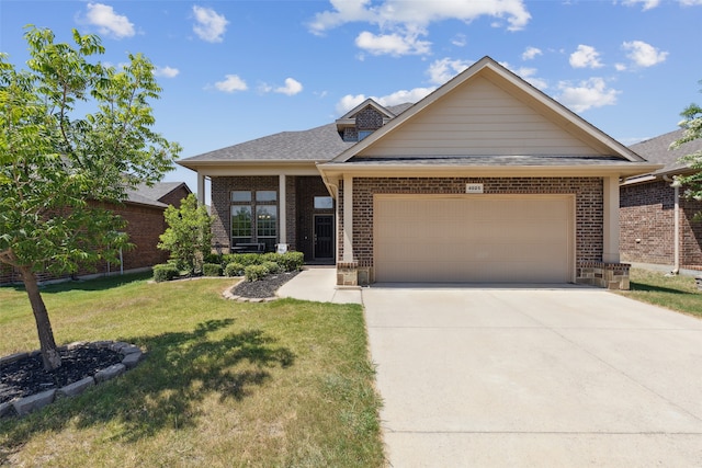 craftsman house with a garage and a front yard