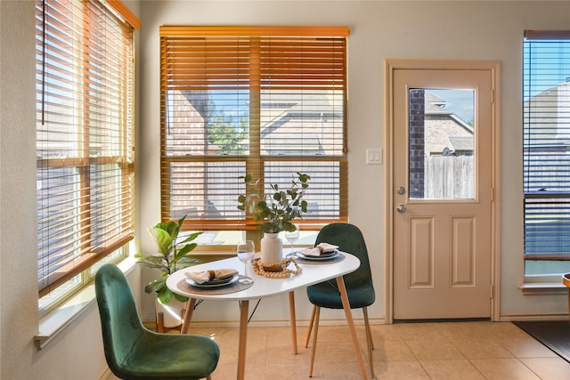 dining space featuring light tile patterned floors