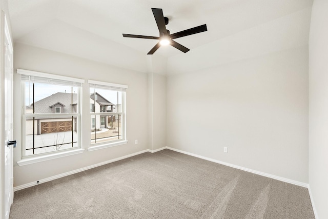 spare room featuring carpet floors and ceiling fan