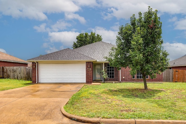 ranch-style house featuring a front yard and a garage