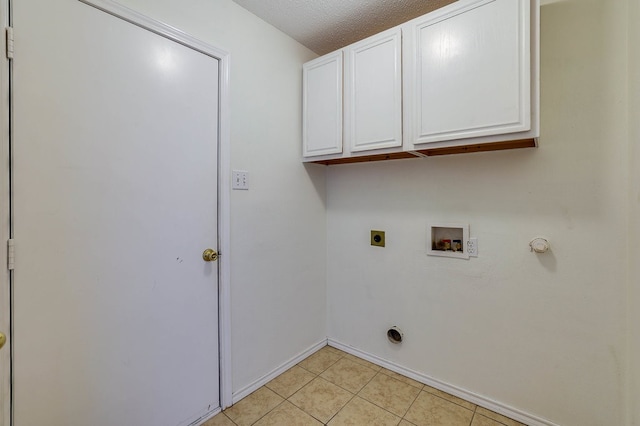 laundry room featuring cabinet space, light tile patterned floors, hookup for a gas dryer, hookup for an electric dryer, and washer hookup