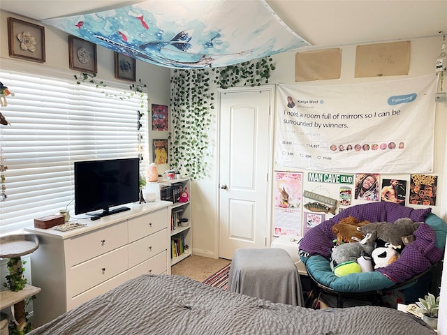 bedroom featuring light colored carpet