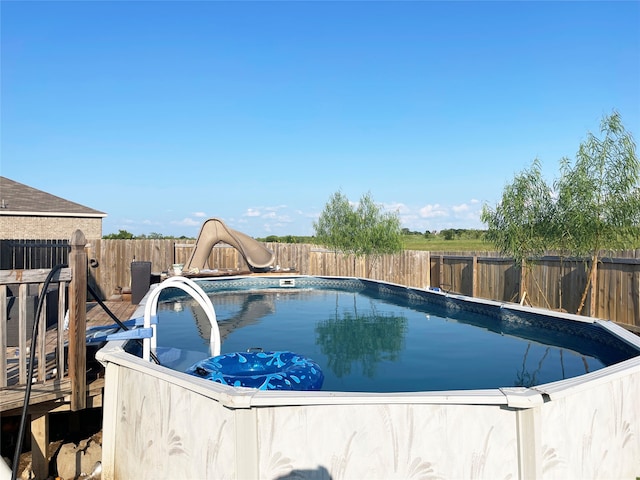 view of pool featuring a water slide