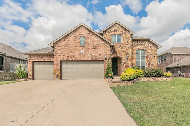 view of front property with a garage and a front yard