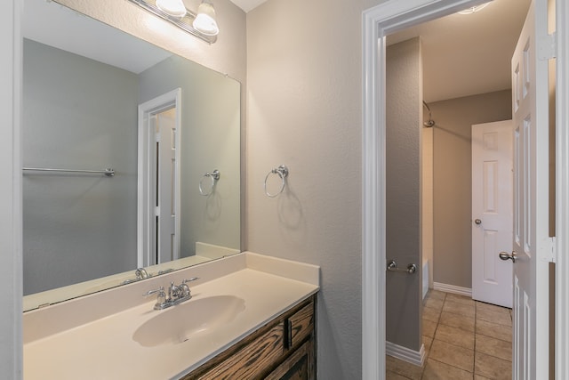 bathroom featuring tile patterned floors and vanity