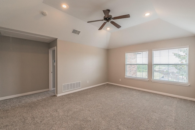 carpeted empty room featuring lofted ceiling and ceiling fan