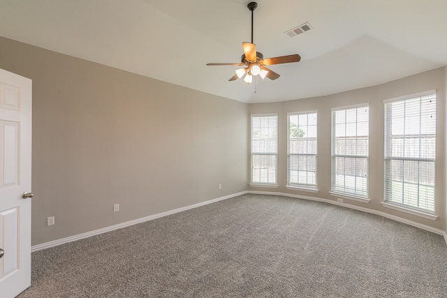 spare room featuring carpet floors and ceiling fan