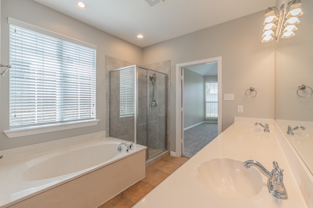 bathroom featuring tile patterned flooring, separate shower and tub, and double sink vanity