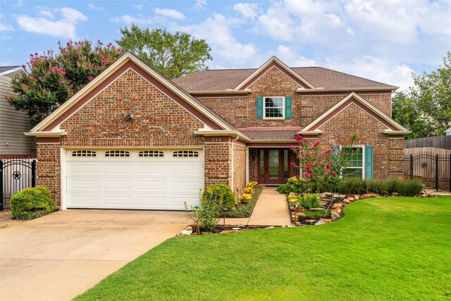 view of front facade featuring a garage and a front yard