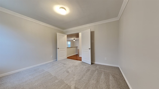 unfurnished bedroom with carpet and ornamental molding