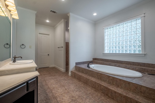 bathroom with vanity, tiled tub, and crown molding