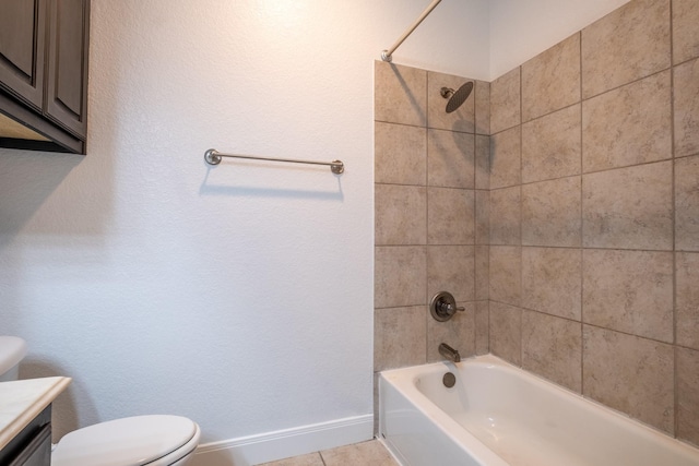 full bathroom with vanity, toilet, tiled shower / bath, and tile patterned floors