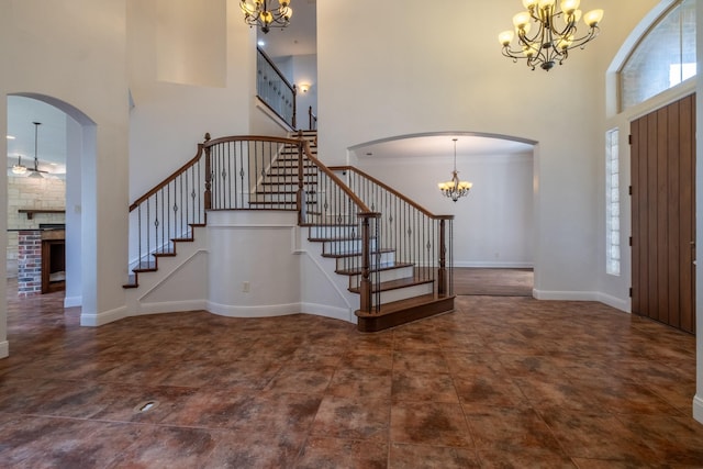 entryway with a chandelier and a high ceiling