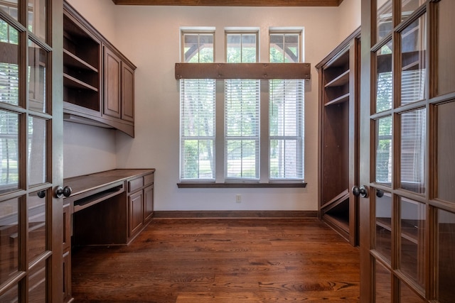 interior space with dark wood-type flooring and french doors