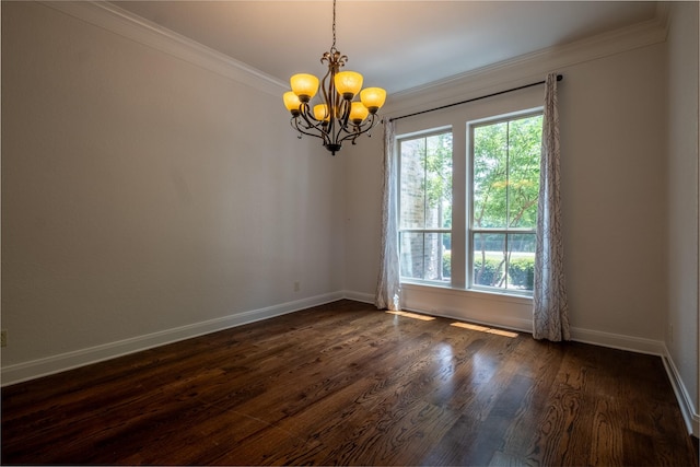 unfurnished room featuring crown molding, dark hardwood / wood-style floors, an inviting chandelier, and a healthy amount of sunlight