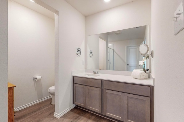 bathroom featuring a shower with door and hardwood / wood-style flooring