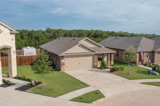 view of front of house with a garage and a front lawn