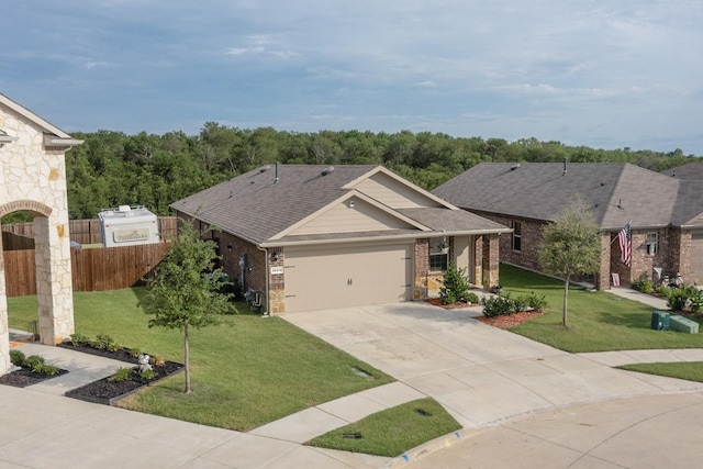 view of front facade featuring a garage and a front lawn