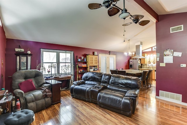 108 5th St, Whitney, TX 76692 - living area with a ceiling fan, lofted ceiling, wood-type flooring, a chandelier, and plenty of natural light