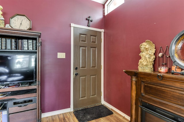 108 5th St, Whitney, TX 76692 - entrance foyer with wood finished floors and baseboards