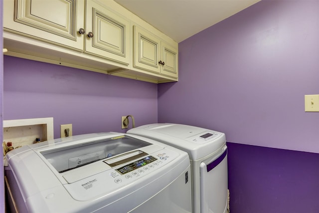 108 5th St, Whitney, TX 76692 - washroom featuring washing machine and dryer and cabinet space