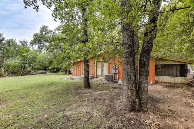 108 5th St, Whitney, TX 76692 - view of green lawn featuring central AC unit