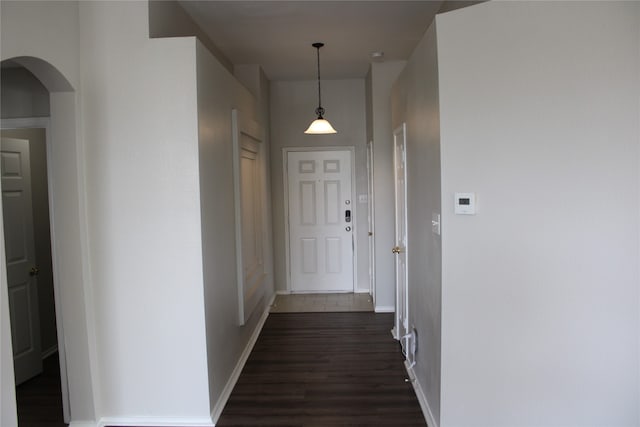 corridor featuring dark hardwood / wood-style flooring