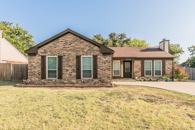 ranch-style house with a front lawn