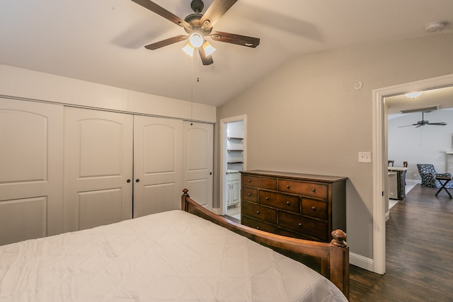 bedroom featuring ceiling fan, a closet, dark wood-type flooring, and vaulted ceiling