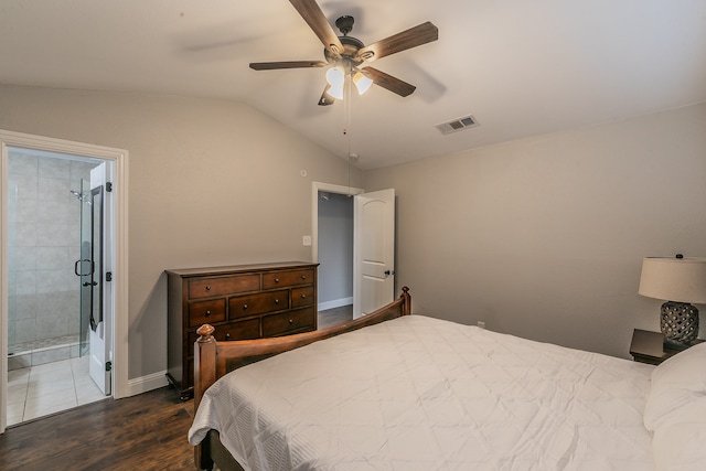 bedroom featuring ceiling fan, dark hardwood / wood-style floors, lofted ceiling, and ensuite bath