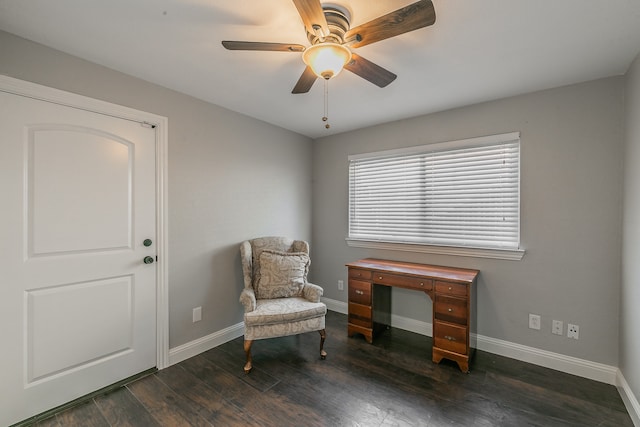 living area featuring ceiling fan and dark hardwood / wood-style floors