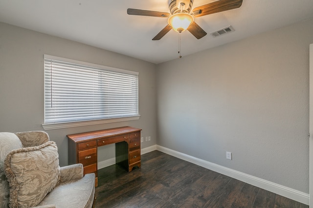 sitting room featuring ceiling fan and dark hardwood / wood-style floors