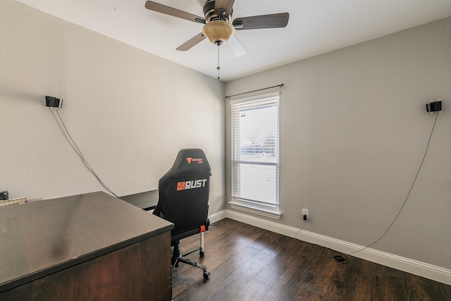 office space with plenty of natural light, ceiling fan, and dark hardwood / wood-style flooring