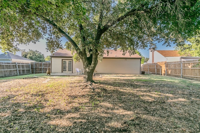 back of property featuring a lawn