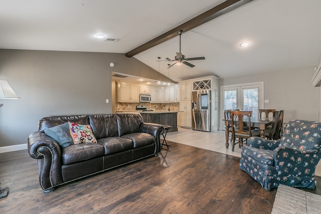 living room featuring hardwood / wood-style flooring, ceiling fan, french doors, and lofted ceiling with beams