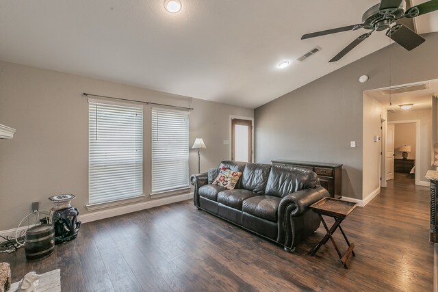 living room with ceiling fan, dark hardwood / wood-style flooring, and lofted ceiling