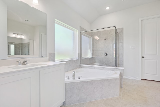 bathroom with vanity, separate shower and tub, lofted ceiling, and tile patterned floors