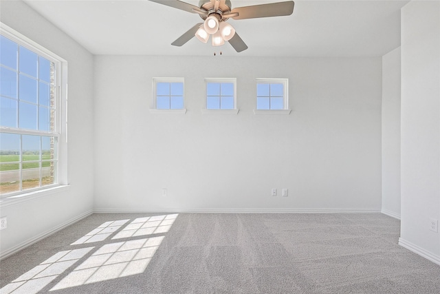 carpeted empty room with ceiling fan