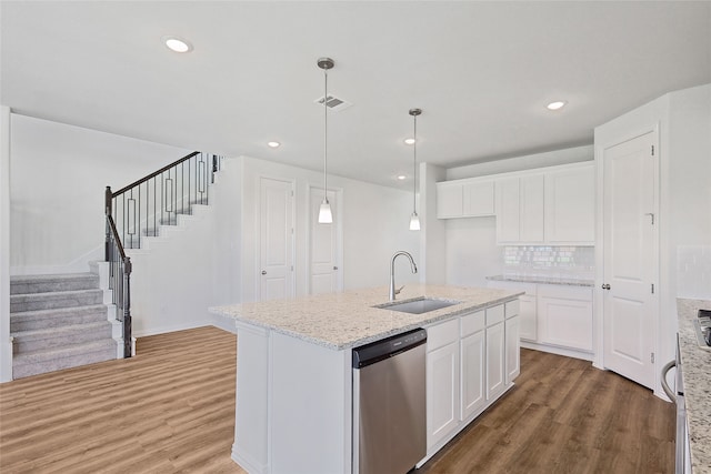 kitchen featuring dishwasher, sink, dark wood-type flooring, and white cabinets