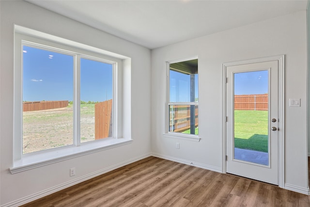 doorway to outside with hardwood / wood-style floors