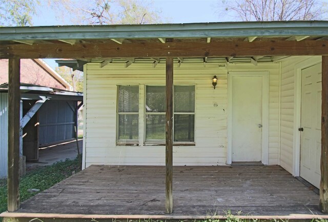 entrance to property with a wooden deck