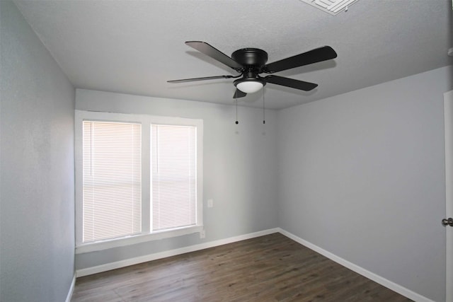 spare room featuring ceiling fan and hardwood / wood-style floors