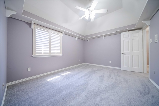 spacious closet featuring lofted ceiling, carpet floors, and ceiling fan