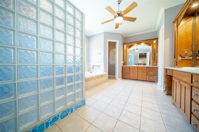 bathroom featuring tile patterned flooring, ornamental molding, vanity, a relaxing tiled tub, and ceiling fan