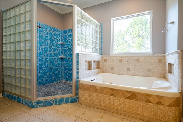 bathroom with crown molding, tile patterned floors, and shower with separate bathtub