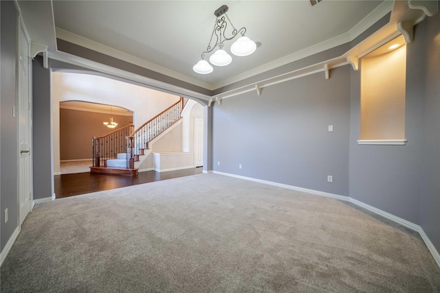 interior space with crown molding and a chandelier