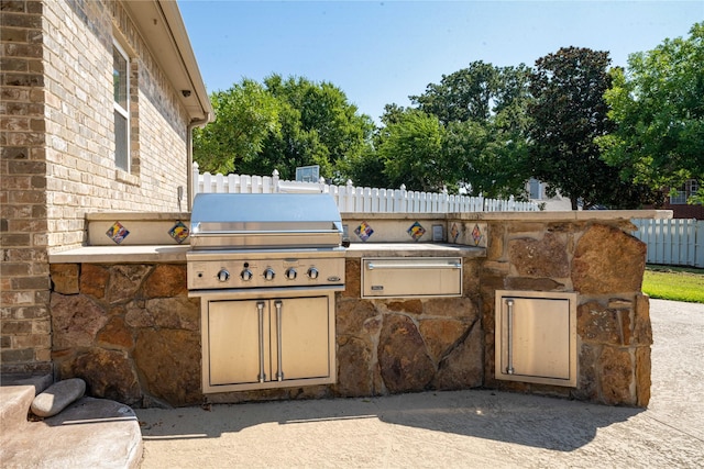 view of patio with grilling area and exterior kitchen