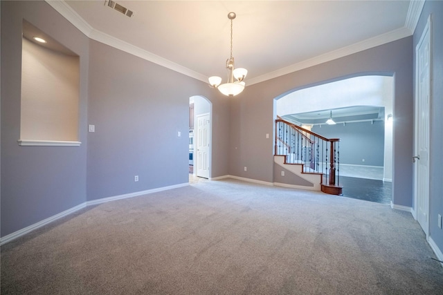 empty room with ornamental molding and carpet