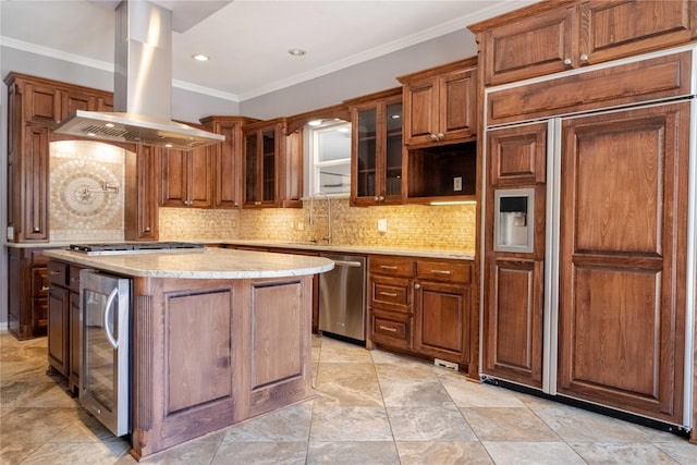 kitchen with decorative backsplash, beverage cooler, appliances with stainless steel finishes, and island exhaust hood