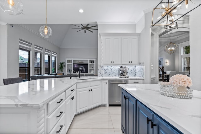 kitchen featuring dishwasher, a center island, vaulted ceiling, blue cabinets, and white cabinets